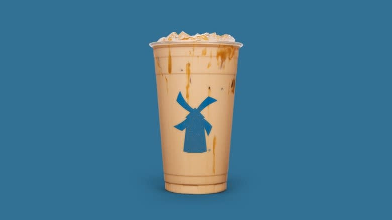 Chowhound Dutch Bros' Most Popular Drink 2 the Golden Eagle in a Dutch Bros cup with a blue background—Dutch Bros Coffee