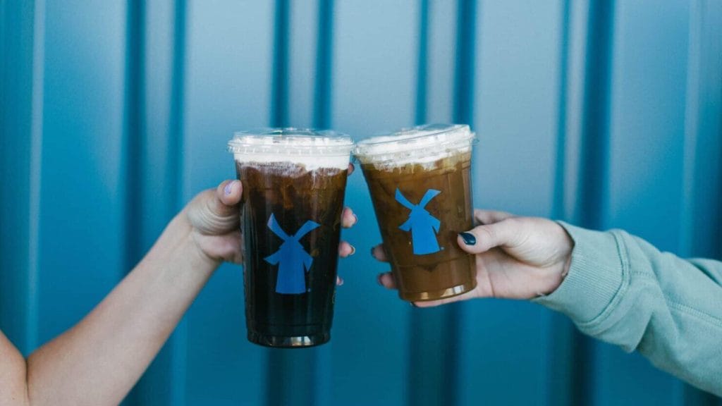 DUTCH BROS® DRIVE THRU FAVES 1 Customers appear with Dutch Bros cups throughout the Netherlands.